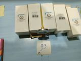 four boxes and a spoon sitting on a table