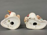 pair of porcelain figurines of a bird and a bird on a branch