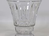 a glass vase that is sitting on a table