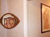 a picture of a bathroom with a mirror on the wall