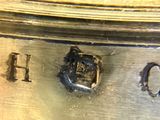 a close up of a metal object with the word h on it
