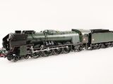 a toy train on a white surface with a white background