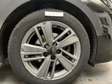 a close up of a car ' s wheel with a sticker on it