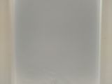 a white square object on a table with a white background