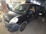 a picture of a small black car in a garage