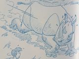 someone is drawing a rhino in a book with a pencil