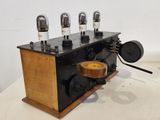 an old fashioned radio that is sitting on a table