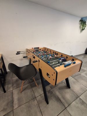 a foosball table in the corner of a room