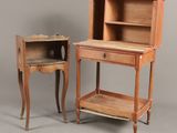 two pieces of furniture are sitting on a gray surface