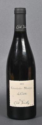 a bottle of wine that is sitting on a table