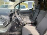 the interior of a car with the front seats down and a steering wheel in the center