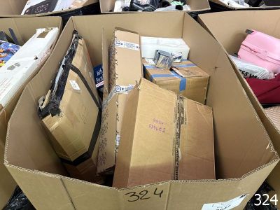 many boxes of luggage sitting in a pile on the ground