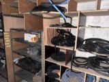 a room with a lot of wires and wires on the shelves