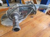 a small machine that is sitting on a wooden table