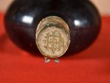 a close up of a wine bottle with a cork stopper