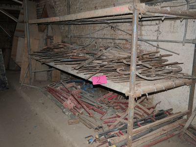 a lot of tools that are on a shelf in a room