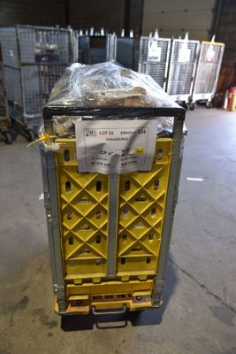 a cart with a bunch of boxes on it in a warehouse