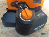 a black and orange box with a black and orange lid