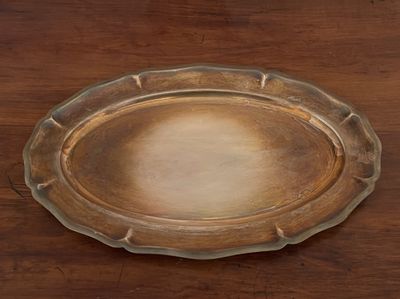 a glass plate that is on a wooden table