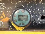 a close up of a digital clock on the side of a train