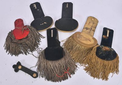 several different types of brooms and hats on a white surface