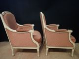 pair of antique french style chairs with pink upholstered upholstered cushions