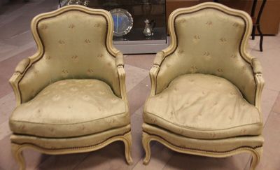 two chairs sitting next to each other on the floor