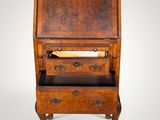 an old wooden desk with drawers and a roll top top