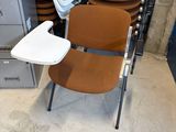 a stack of chairs and a table in a room