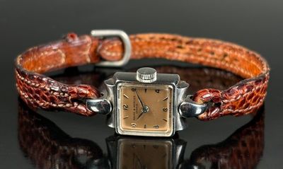 BAUME & MERCIER Montre de dame en acier, boitier rectangulai…