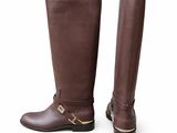 a pair of brown boots on a white background