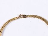 an image of a gold chain bracelet with a clasp on a white background