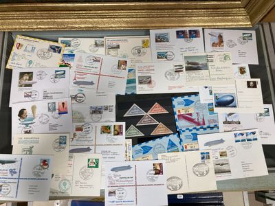 a picture of a collection of postcards and envelopes on a window sill