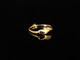 a gold ring with a black stone in the middle