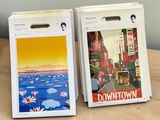 two boxes with pictures on them sitting on a table