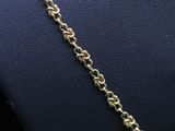 a close up of a gold chain on a mannequin mannequin mannequin mannequin mannequin mannequin mannequin manne