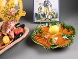 a bowl of fruit and a bowl of fish on a table
