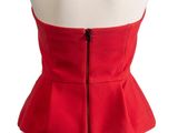 the back view of a red dress with a zippered waist