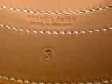 a close up of a brown leather belt with white stitching on it