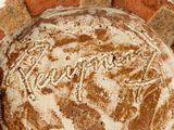 a close up of a bread pan on a brick wall