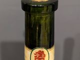 a bottle of wine that is sitting on a table
