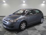 grey citrole parked in a room with checkered flooring