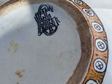 a close up of a vase with a design on it