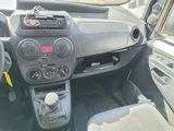 a dashboard of a car with a radio and a steering wheel