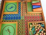 a wooden box with a game set inside of it