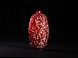 an image of a red vase on a black surface