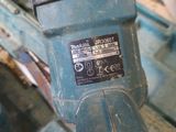 a close up of a blue drill on a table
