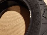 a close up of a tire on top of a cardboard box