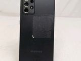 the back of a black samsung galaxy s20 with a fingerprint on it