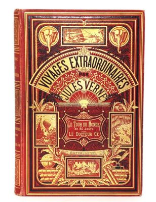 un vieux livre à la couverture rouge et aux lettres dorées